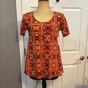 LuLaRoe small Women's Short Sleeve Scoop Neck Top in Orange Mosaic Print